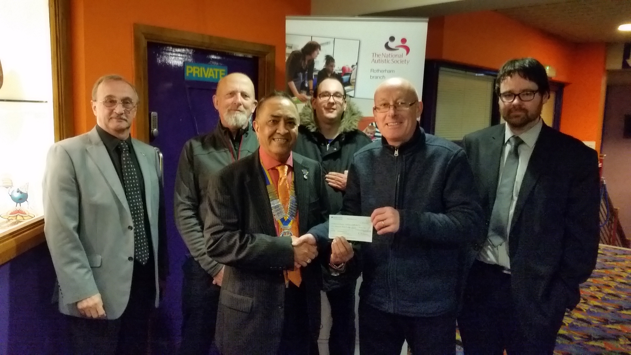 President Yogesh and Immediate Past President Graham present a cheque for £1200 to representatives of the Autistic Society (Russell Wells - Branch Treasurer, Leon Allcock - Branch President, Paul Truin - Volunteer and Darren Walmsley, a member of the National Autistic Society 