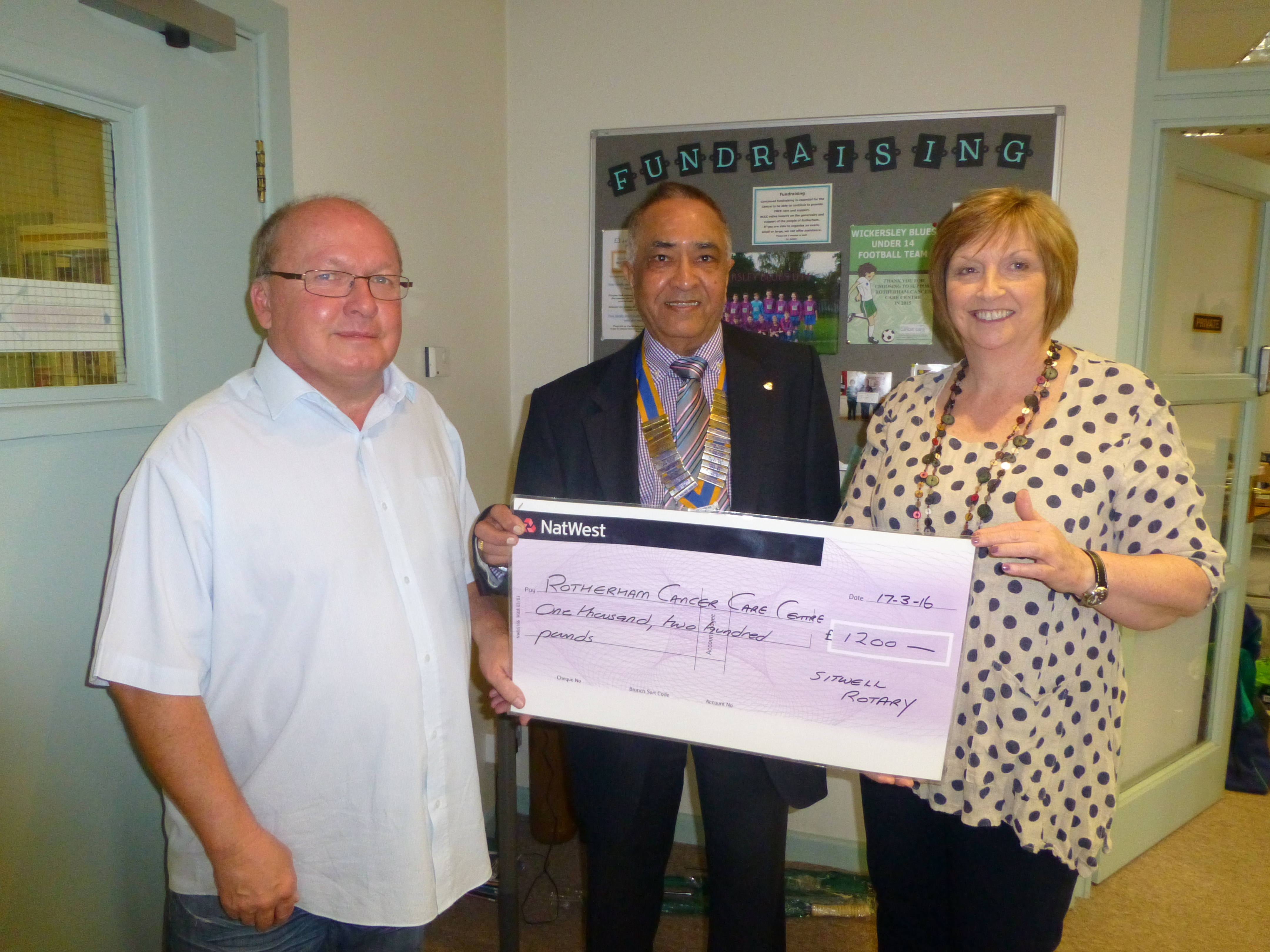 President Yogesh with Angela Bintcliffe and John Hyslop of the Rotherham Cancer Care Centre.