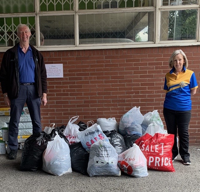 President Trish and President-Elect Steve with the clothing donation