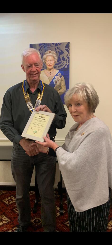 Trish presents the certificate to President Steve